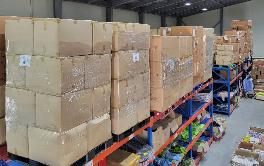 Palletised cartons and racked apparel inside the Korea warehouse
