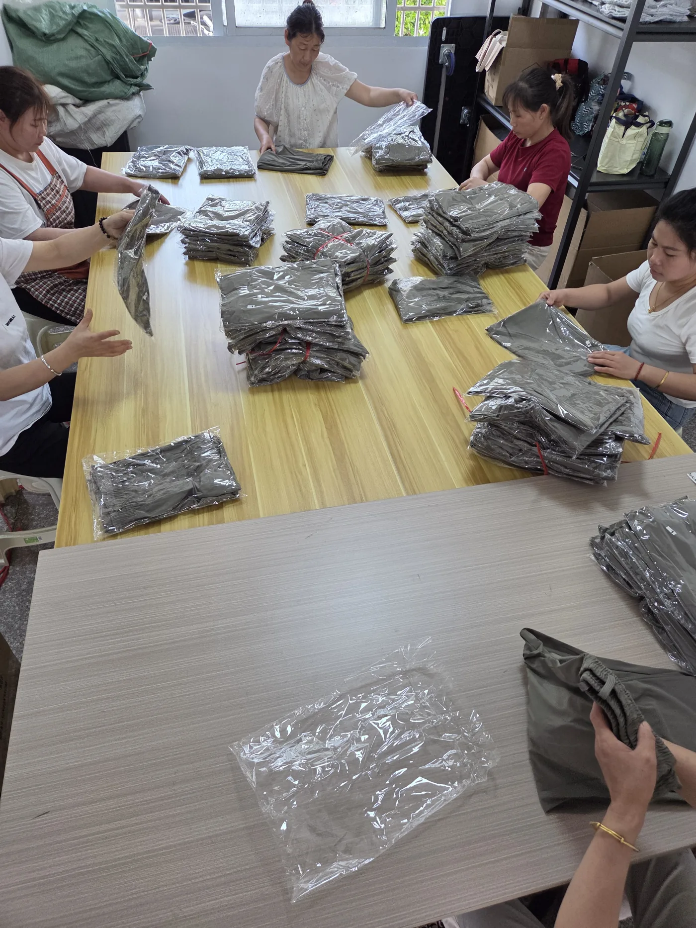 Finished garments bagged and sorted before dispatch — OQC