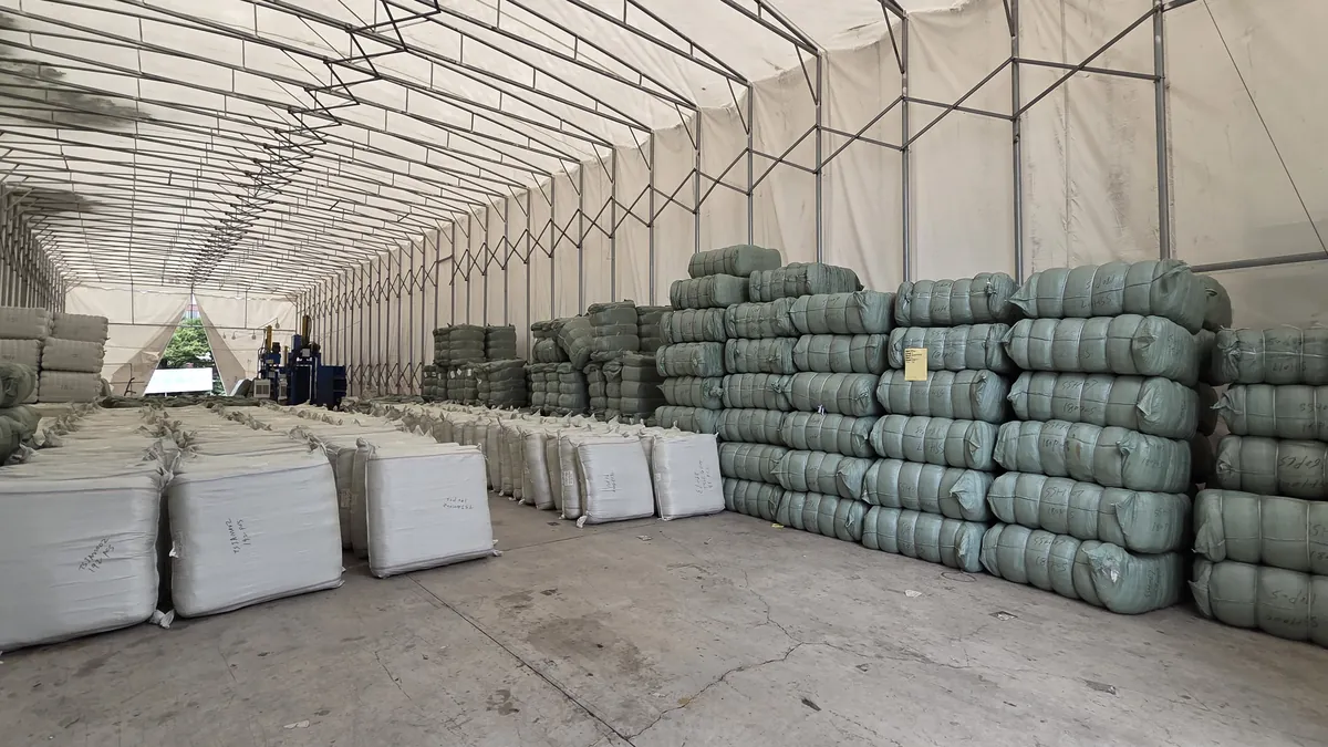 Finished goods baled and stacked under a covered yard